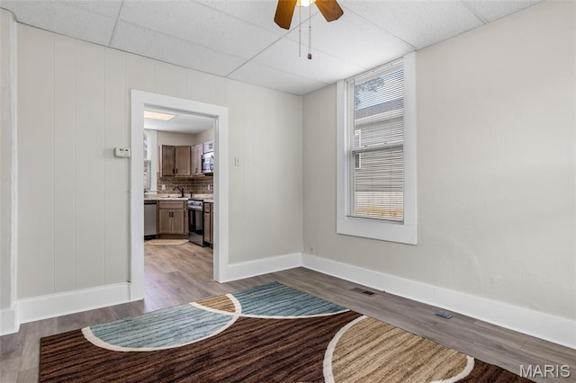 229 Broadway Ave, Crystal City, MO 63019 - empty room with wood finished floors and a ceiling fan