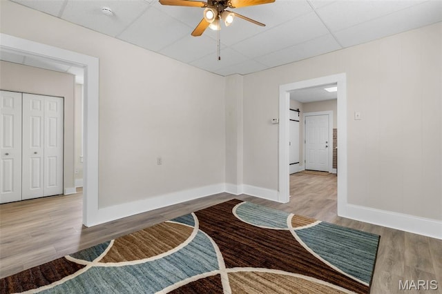 229 Broadway Ave, Crystal City, MO 63019 - interior space with wood finished floors, ceiling fan, and a paneled ceiling