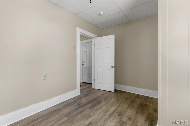 229 Broadway Ave, Crystal City, MO 63019 - empty room featuring a paneled ceiling, wood finished floors, and a smoke detector