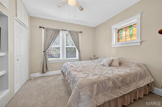 5965 S Cuba Ct, Saint Louis, MO 63139 - carpeted bedroom with baseboards and a ceiling fan