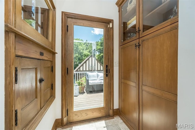 444 Algonquin Pl, Webster Groves, MO 63119 - doorway with baseboards and light stone finish flooring