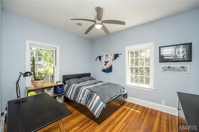 444 Algonquin Pl, Webster Groves, MO 63119 - bedroom with wood finished floors, a ceiling fan, and an office area