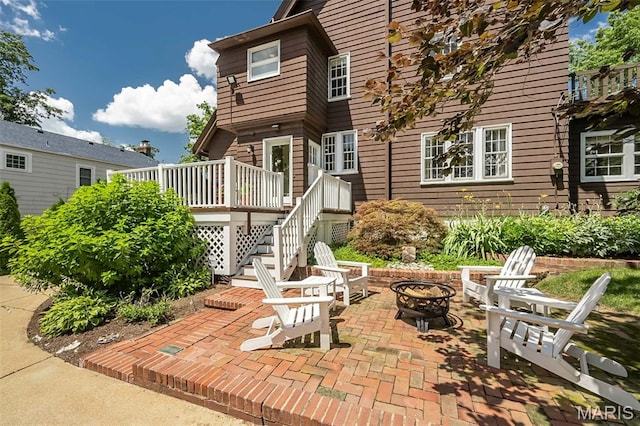 444 Algonquin Pl, Webster Groves, MO 63119 - view of patio / terrace featuring an outdoor fire pit, stairway, and a wooden deck