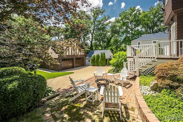 444 Algonquin Pl, Webster Groves, MO 63119 - view of yard with a fire pit, stairway, an outbuilding, and a patio area