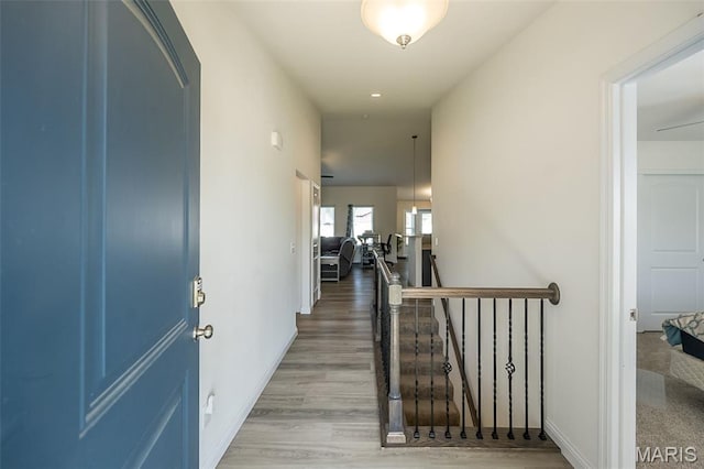 229 Essex Ct, Wright City, MO 63390 - hallway with light wood-style flooring and an upstairs landing