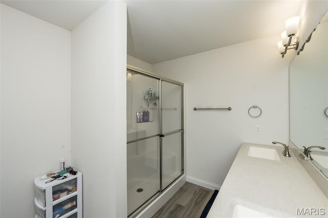 229 Essex Ct, Wright City, MO 63390 - bathroom featuring wood finished floors, a shower stall, and double vanity
