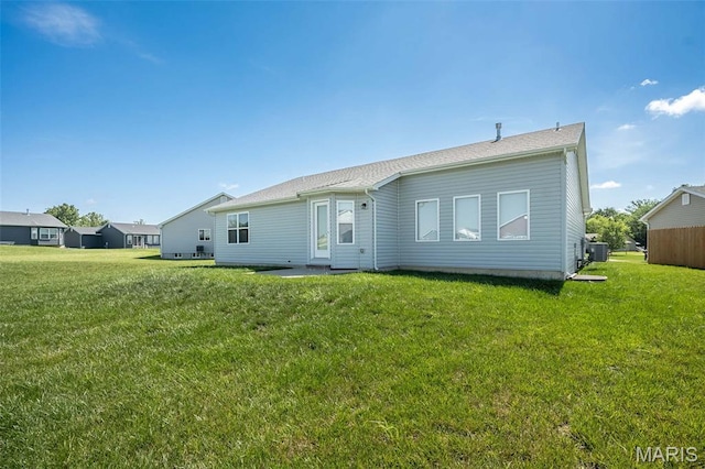 229 Essex Ct, Wright City, MO 63390 - rear view of property with a yard