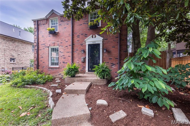 1076 N Jackson Ave, University City, MO 63130 - view of front facade featuring brick siding
