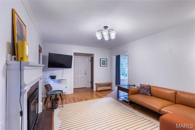 1076 N Jackson Ave, University City, MO 63130 - living area featuring wood finished floors and a fireplace
