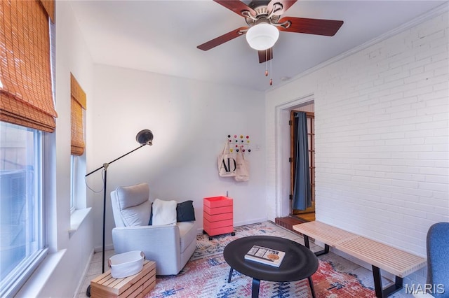 1076 N Jackson Ave, University City, MO 63130 - living area featuring brick wall and ceiling fan