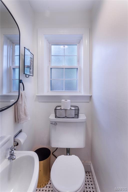 1076 N Jackson Ave, University City, MO 63130 - bathroom featuring a sink and toilet