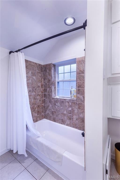 1076 N Jackson Ave, University City, MO 63130 - bathroom with shower / tub combo, tile patterned flooring, and vaulted ceiling