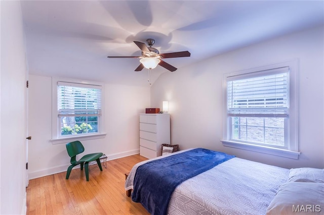 1076 N Jackson Ave, University City, MO 63130 - bedroom with hardwood / wood-style floors and a ceiling fan