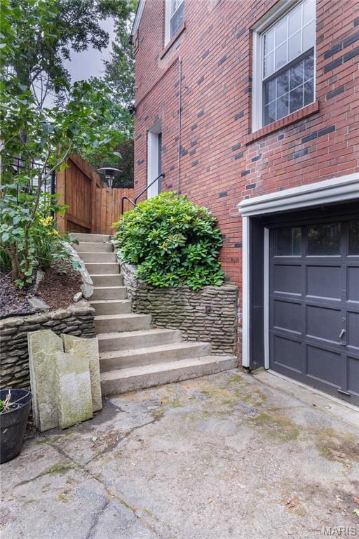 1076 N Jackson Ave, University City, MO 63130 - property entrance featuring brick siding