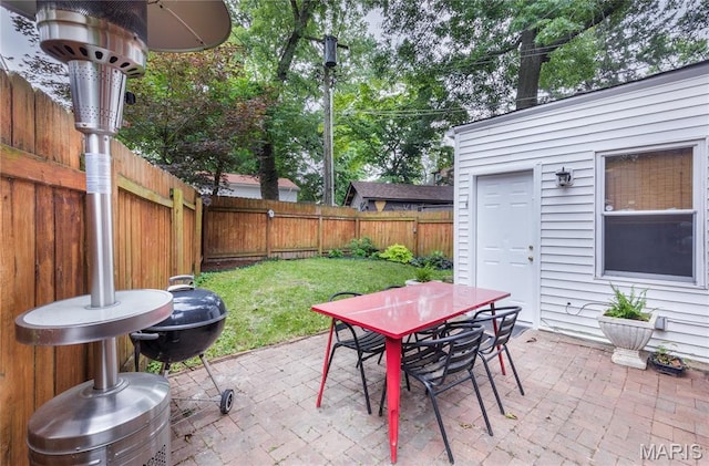 1076 N Jackson Ave, University City, MO 63130 - fenced backyard with outdoor dining space and a patio