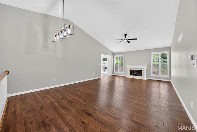 2417 S Lakeridge Ct Unit 14, Lake St Louis, MO 63367 - unfurnished living room featuring plenty of natural light, dark wood-style flooring, ceiling fan, high vaulted ceiling, and a fireplace