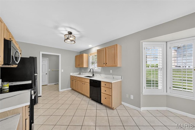 2417 S Lakeridge Ct Unit 14, Lake St Louis, MO 63367 - kitchen with stove, light countertops, light tile patterned floors, light brown cabinetry, and dishwasher