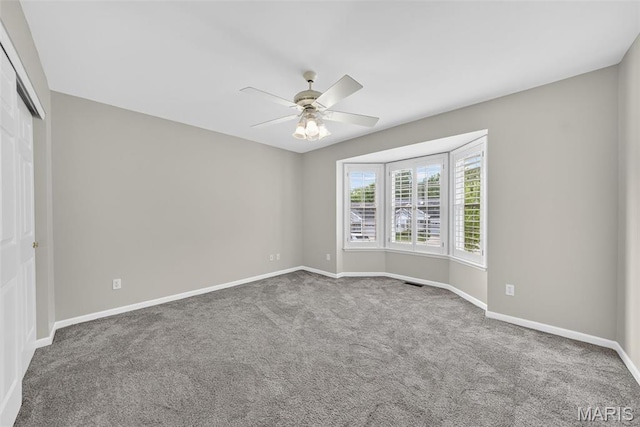 2417 S Lakeridge Ct Unit 14, Lake St Louis, MO 63367 - carpeted spare room featuring ceiling fan and baseboards