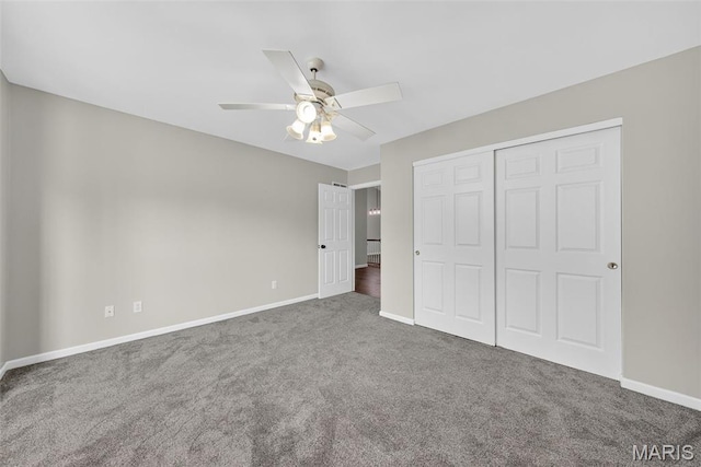 2417 S Lakeridge Ct Unit 14, Lake St Louis, MO 63367 - unfurnished bedroom with carpet, a closet, and ceiling fan