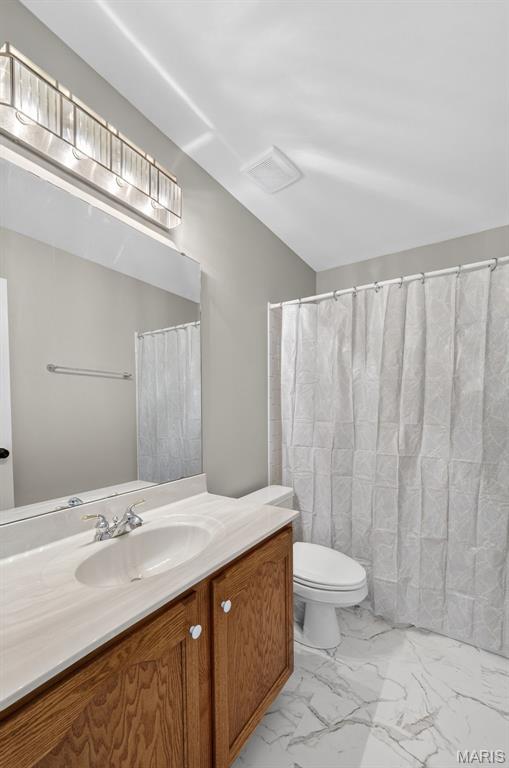 2417 S Lakeridge Ct Unit 14, Lake St Louis, MO 63367 - full bathroom with marble finish flooring and vanity