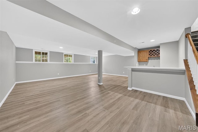 2417 S Lakeridge Ct Unit 14, Lake St Louis, MO 63367 - below grade area with stairs, wet bar, light wood finished floors, and recessed lighting