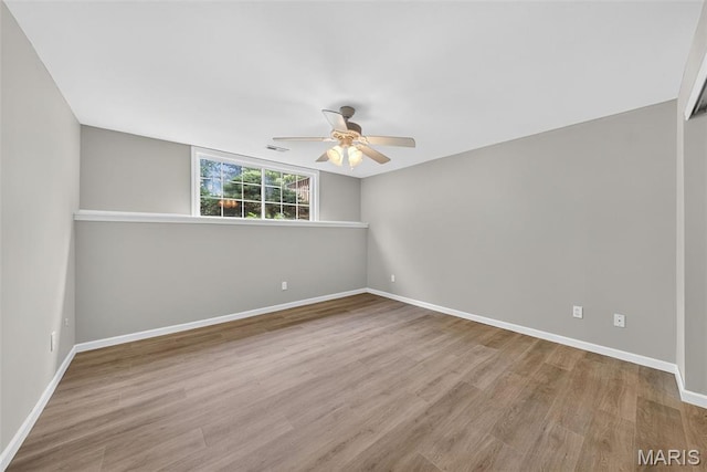 2417 S Lakeridge Ct Unit 14, Lake St Louis, MO 63367 - empty room with a ceiling fan and wood finished floors
