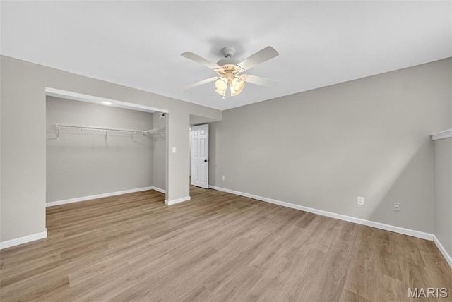 2417 S Lakeridge Ct Unit 14, Lake St Louis, MO 63367 - unfurnished bedroom featuring a closet, light wood-style floors, and ceiling fan