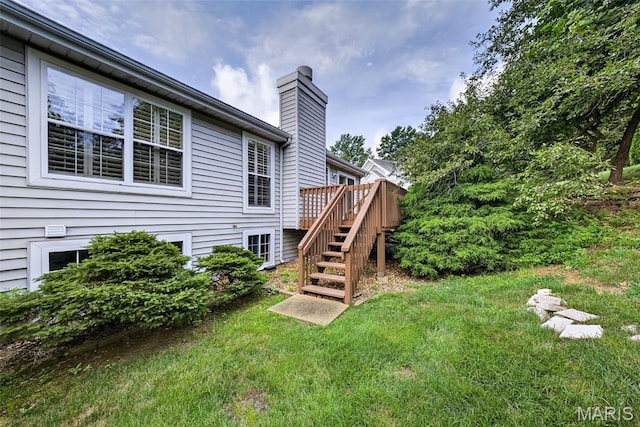2417 S Lakeridge Ct Unit 14, Lake St Louis, MO 63367 - view of green lawn featuring stairway and a deck