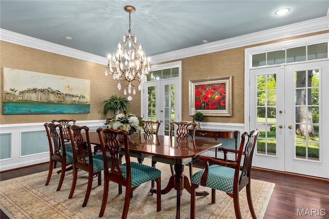 10420 Litzsinger Rd, Frontenac, MO 63131 - dining room featuring french doors, ornamental molding, a chandelier, healthy amount of natural light, and wood finished floors