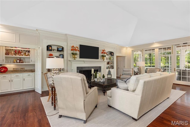 10420 Litzsinger Rd, Frontenac, MO 63131 - living room with vaulted ceiling, wood finished floors, a fireplace, and built in features