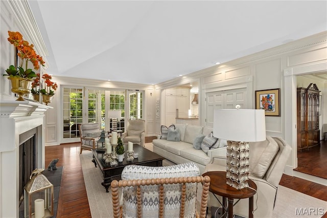 10420 Litzsinger Rd, Frontenac, MO 63131 - living area featuring a decorative wall, crown molding, wood finished floors, recessed lighting, and a fireplace with flush hearth