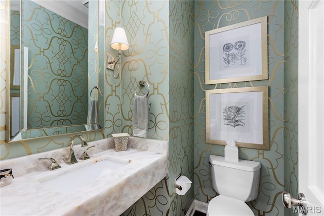 10420 Litzsinger Rd, Frontenac, MO 63131 - bathroom with wallpapered walls, crown molding, and vanity