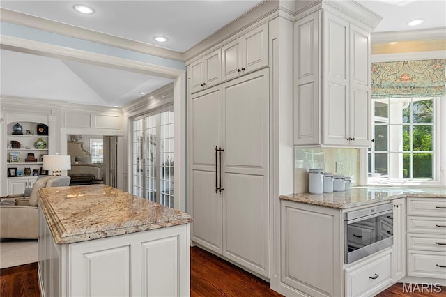 10420 Litzsinger Rd, Frontenac, MO 63131 - kitchen featuring open floor plan, stainless steel microwave, plenty of natural light, light stone countertops, and lofted ceiling