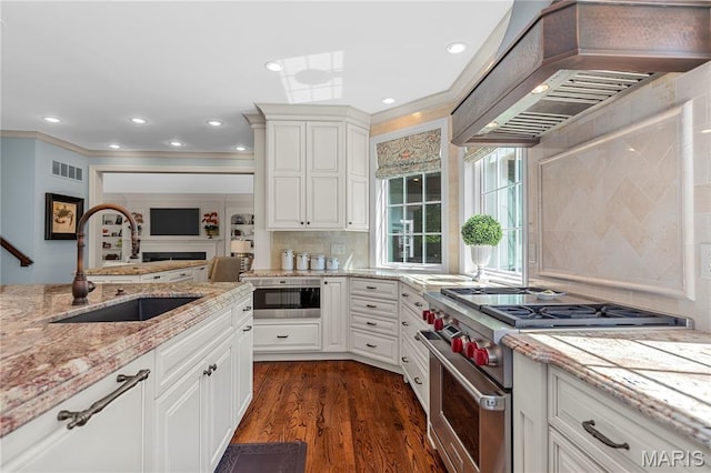 10420 Litzsinger Rd, Frontenac, MO 63131 - kitchen featuring custom range hood, high end stainless steel range, dark wood-style flooring, white cabinetry, and light stone counters