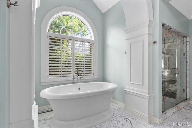 10420 Litzsinger Rd, Frontenac, MO 63131 - bathroom with marble finish floors, a soaking tub, a stall shower, and lofted ceiling