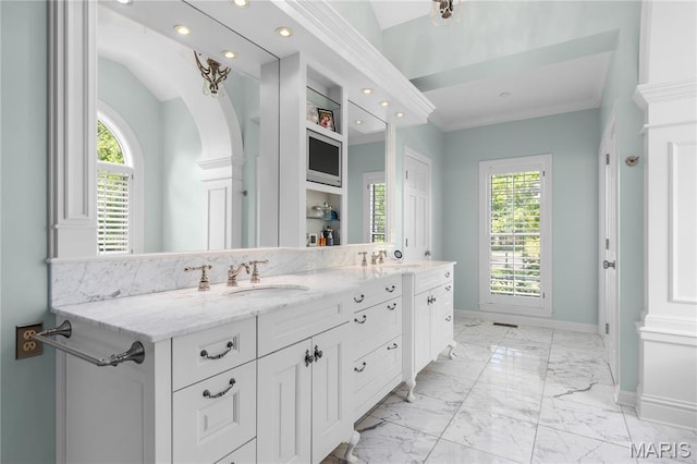 10420 Litzsinger Rd, Frontenac, MO 63131 - bathroom featuring double vanity, marble finish floors, healthy amount of natural light, recessed lighting, and ornamental molding