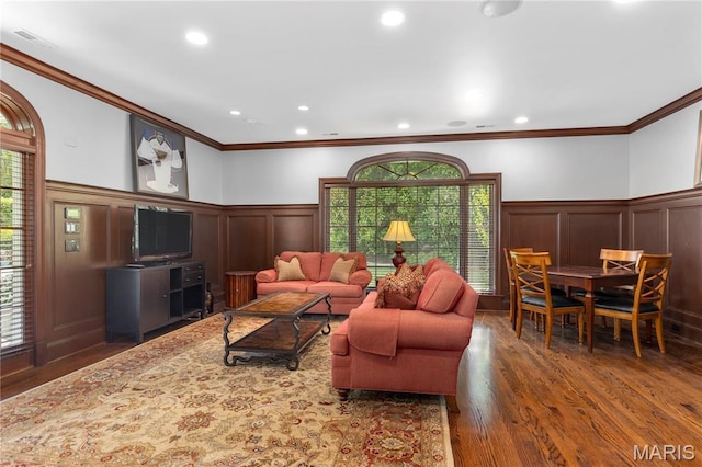 10420 Litzsinger Rd, Frontenac, MO 63131 - living area with a decorative wall, ornamental molding, plenty of natural light, wood finished floors, and wainscoting