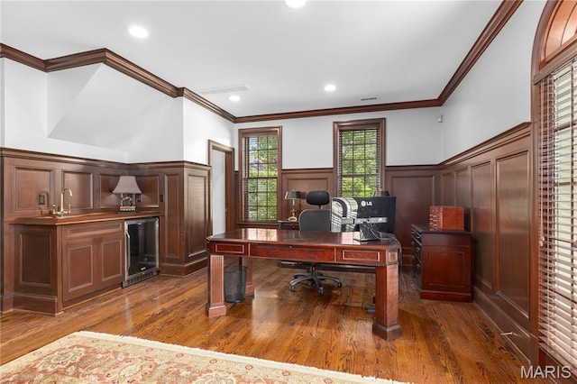10420 Litzsinger Rd, Frontenac, MO 63131 - office featuring a decorative wall, wine cooler, dark wood-style floors, a wainscoted wall, and crown molding