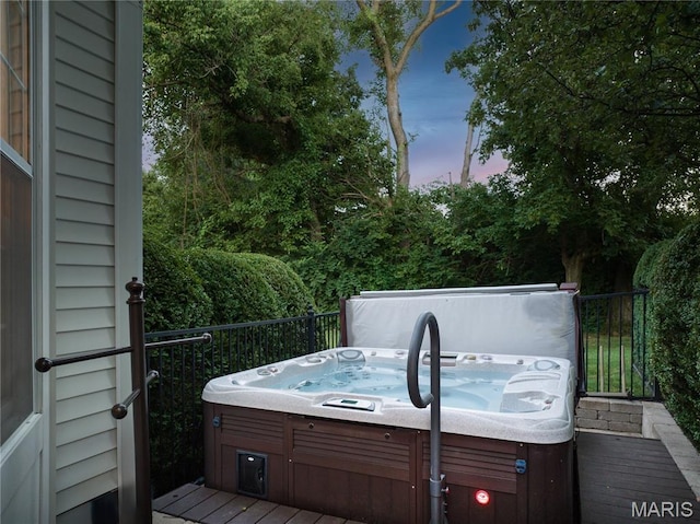 10420 Litzsinger Rd, Frontenac, MO 63131 - deck at dusk with an outdoor hot tub