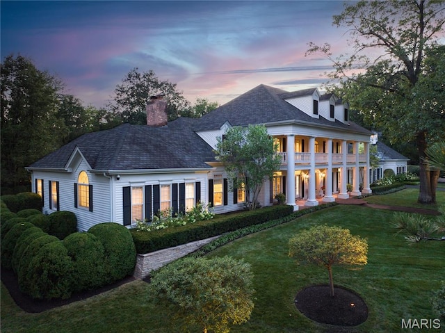 10420 Litzsinger Rd, Frontenac, MO 63131 - neoclassical / greek revival house featuring a front yard and a chimney