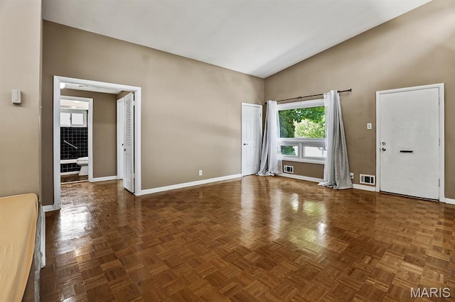 7944 Westover Pl, University City, MO 63130 - empty room featuring baseboards and high vaulted ceiling