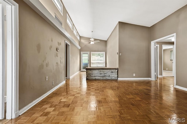 7944 Westover Pl, University City, MO 63130 - unfurnished living room with ceiling fan and high vaulted ceiling