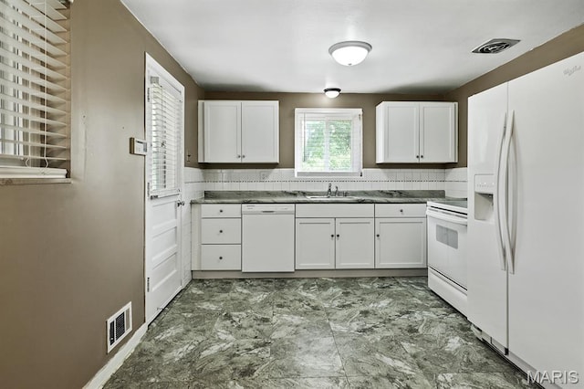 7944 Westover Pl, University City, MO 63130 - kitchen with white appliances, white cabinets, and marble look tile flooring