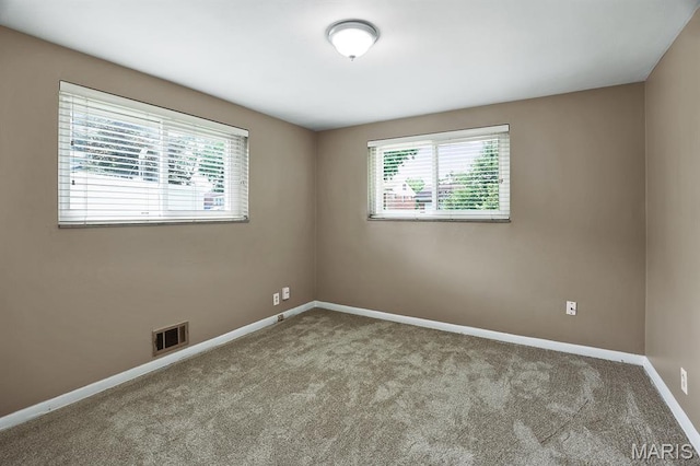7944 Westover Pl, University City, MO 63130 - unfurnished room featuring plenty of natural light and carpet floors