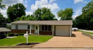 2301 Arkansas Dr, High Ridge, MO 63049 - single story home featuring a garage, driveway, and a front lawn