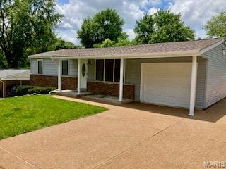 2301 Arkansas Dr, High Ridge, MO 63049 - ranch-style house with a garage, driveway, and a front lawn
