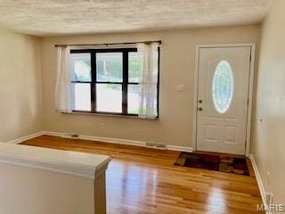 2301 Arkansas Dr, High Ridge, MO 63049 - foyer featuring wood finished floors and a textured ceiling