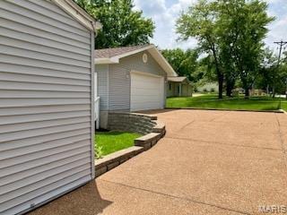 2301 Arkansas Dr, High Ridge, MO 63049 - garage featuring driveway