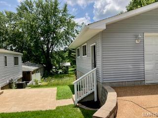 2301 Arkansas Dr, High Ridge, MO 63049 - view of yard with a garage