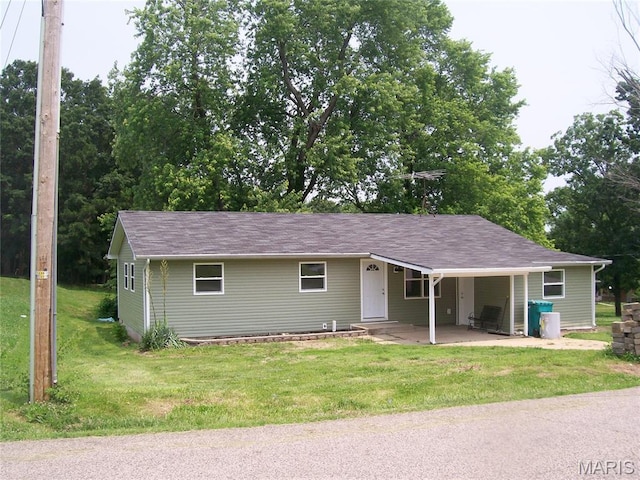 243 Jones St, Sullivan, MO 63080 - ranch-style home with a front lawn, a shingled roof, and an attached carport